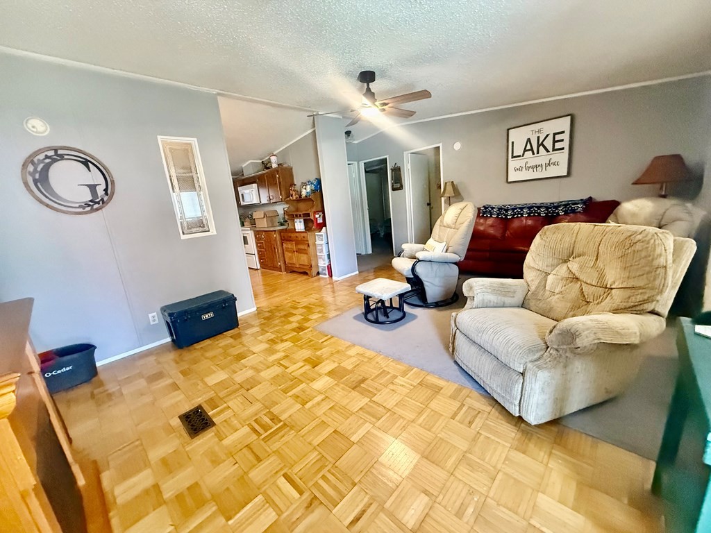220 Sullivan Drive Springville, TN 38256 - Photo 3 of 17 a bed room with a bed mirror and a window