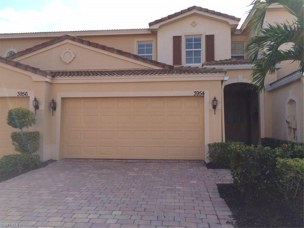 3954 Cherrybrook Loop Fort Myers, FL 33966 - Photo 1 of 16 a front view of a house with a yard and garage