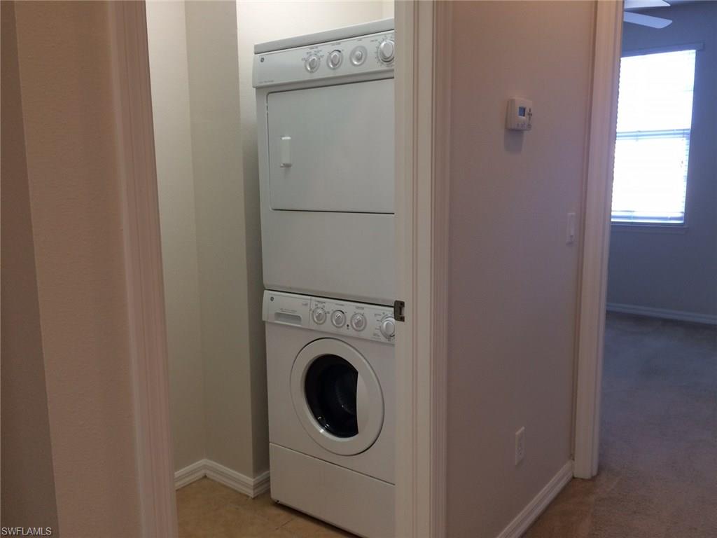 3954 Cherrybrook Loop Fort Myers, FL 33966 - Photo 12 of 16 a utility room with dryer and washer