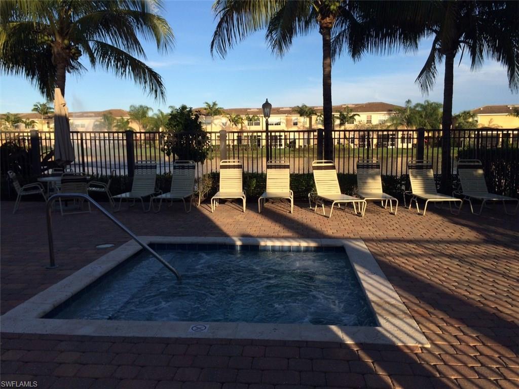 3954 Cherrybrook Loop Fort Myers, FL 33966 - Photo 14 of 16 a view of a swimming pool with a table and chairs