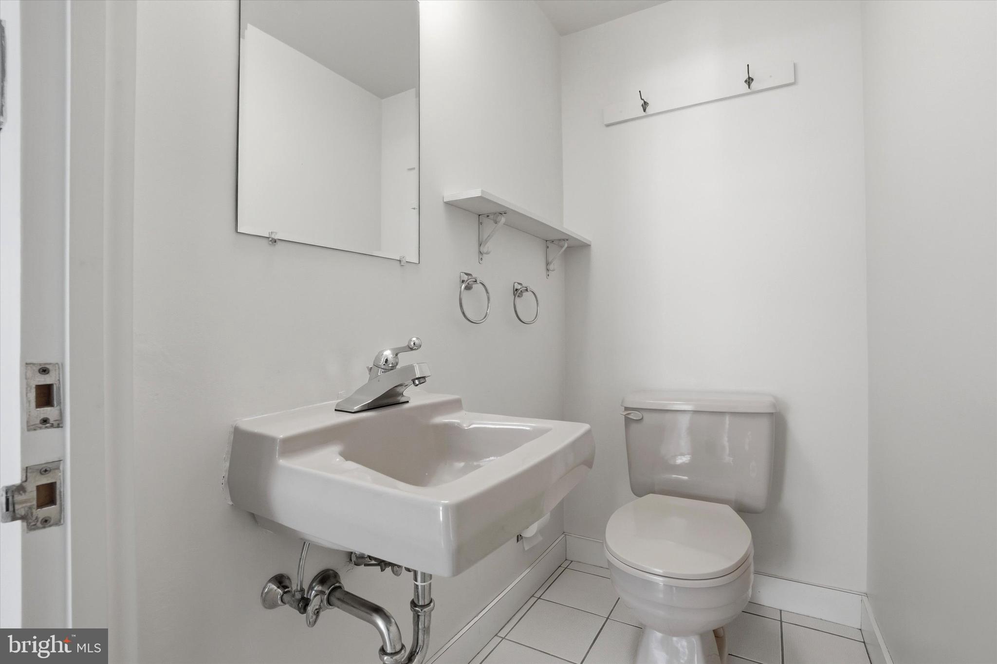 220 West Rittenhouse Square, Unit 22C Philadelphia, PA 19103 - Photo 14 of 29 Half bath off of kitchen
