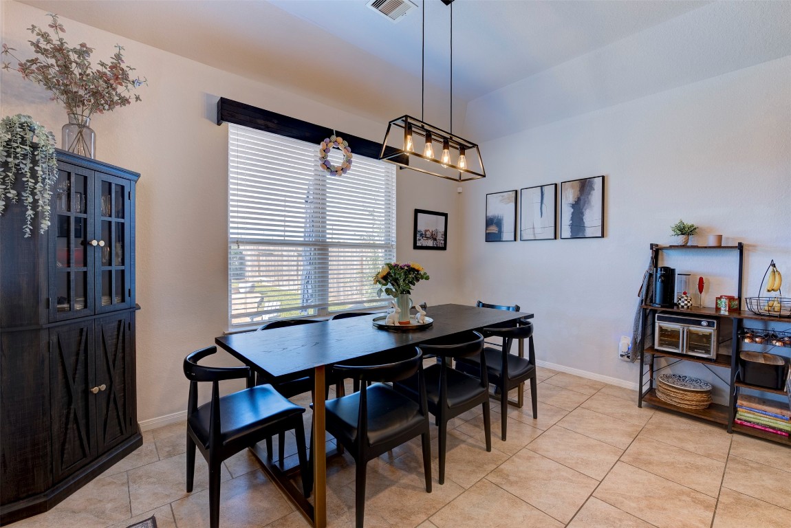 22939 Banff Brook Way Tomball, TX 77375 - Photo 12 of 25 Open and airy dining area with stylish finishes and plenty of space for gatherings.