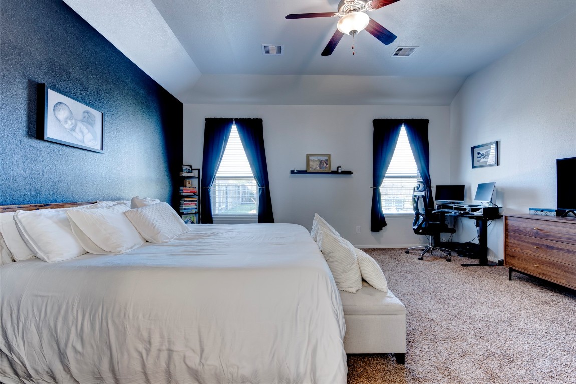 22939 Banff Brook Way Tomball, TX 77375 - Photo 13 of 25 Expansive primary suite offering plenty of room for a sitting area or workspace, complemented by large windows and soft natural light.