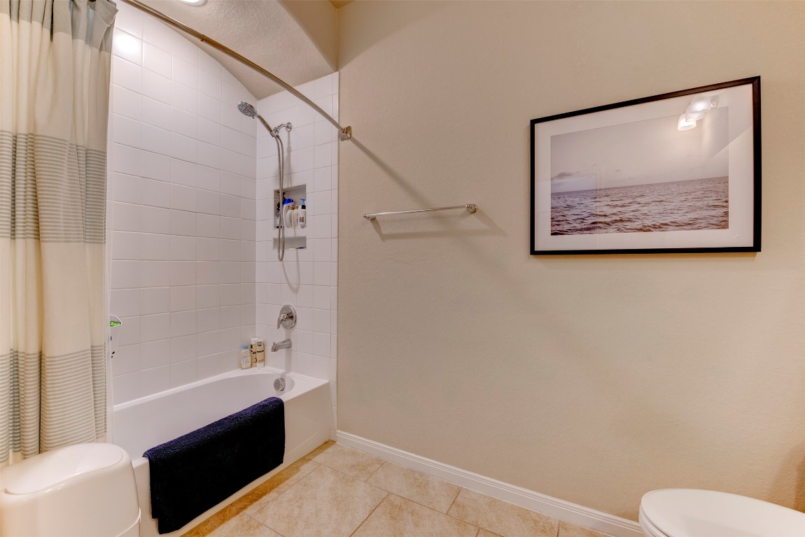 22939 Banff Brook Way Tomball, TX 77375 - Photo 19 of 25 Bright and clean secondary bathroom with tub/shower combo, neutral finishes, and functional layout.