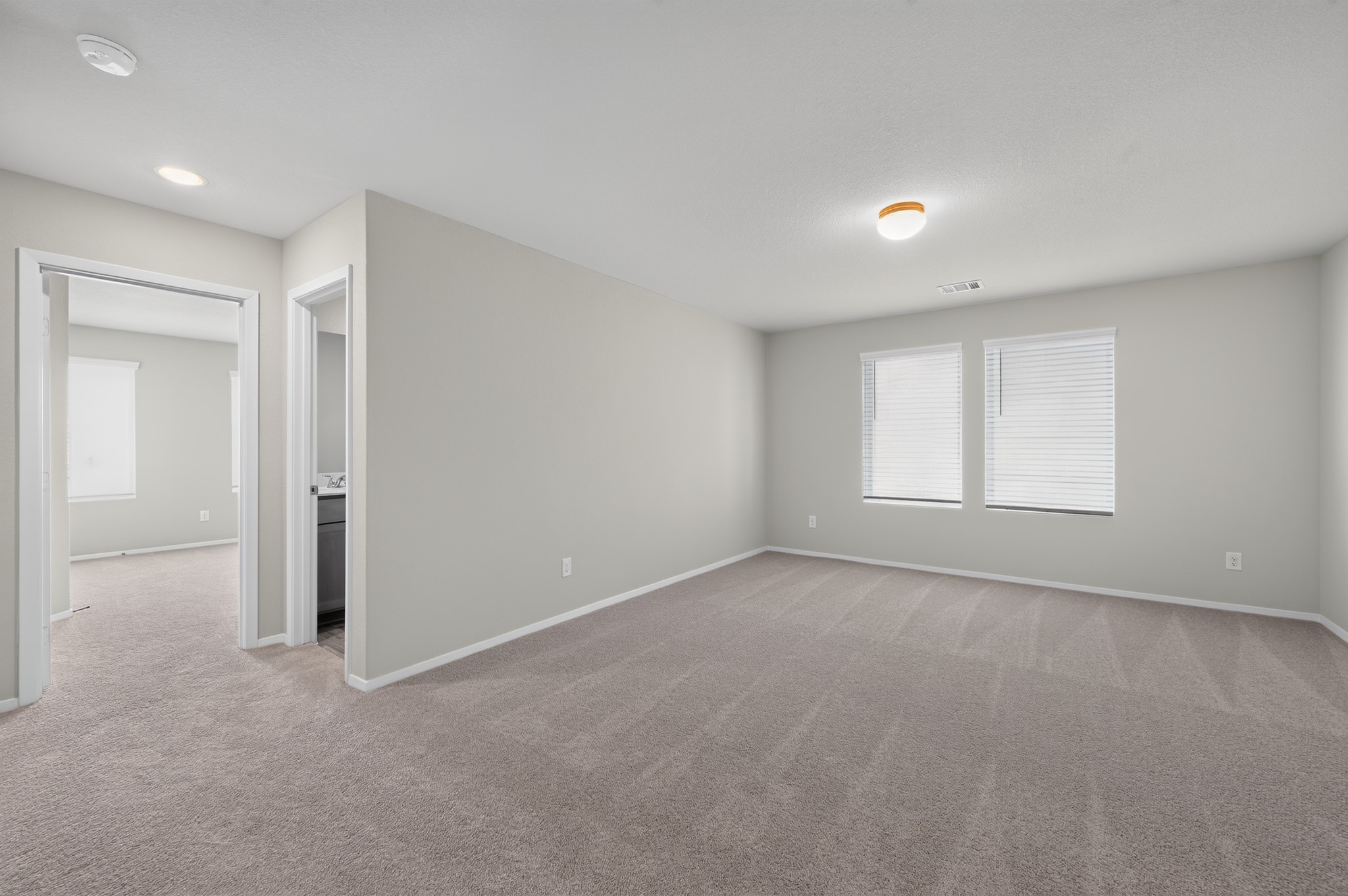 2704 Towy Road Manor, TX 78653 - Photo 11 of 36 Plush carpeting and abundant natural light define this versatile, open upper-level living area.