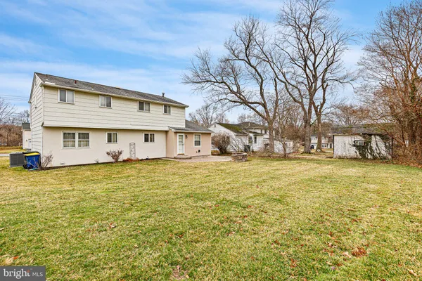 a front view of a building with a yard