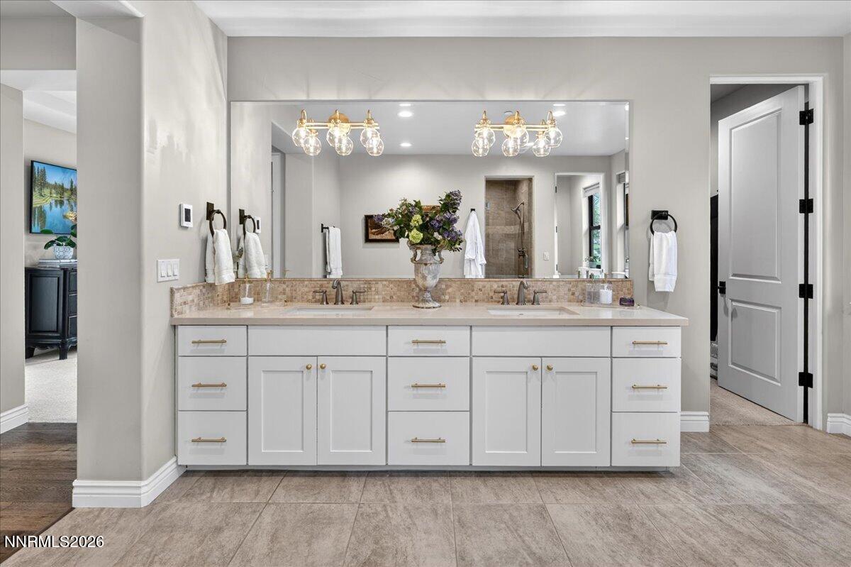 5096 Bordeaux Court Reno, NV 89511 - Photo 37 of 70 a bathroom with a granite countertop double vanity sink mirror and