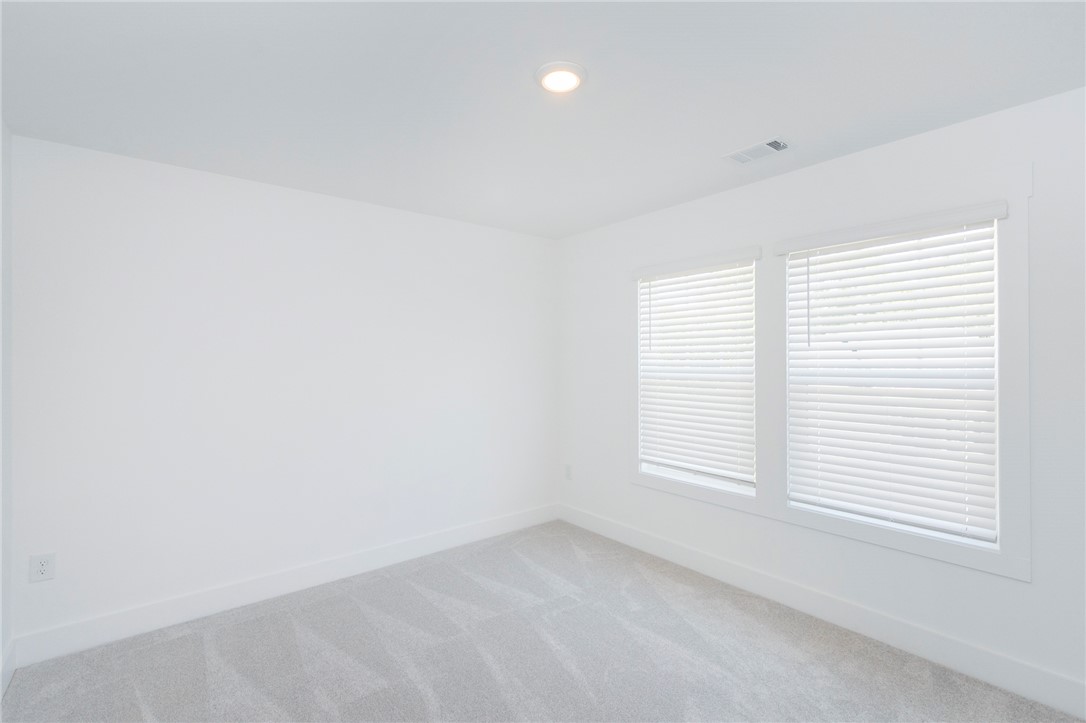 607 WH Kay Lane Anderson, SC 29621 - Photo 23 of 48 A well-lit room featuring neutral tones and ample natural light through well-appointed windows.