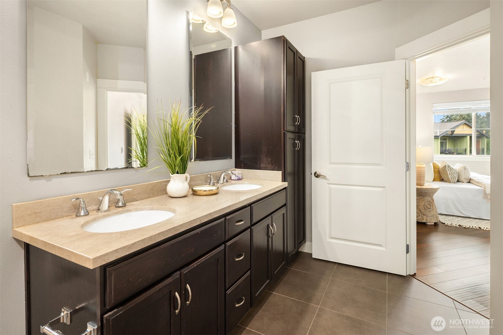 15700 116th Avenue Northeast, Unit 404 Bothell, WA 98011 - Photo 24 of 31 a bathroom with a double vanity sink and a mirror
