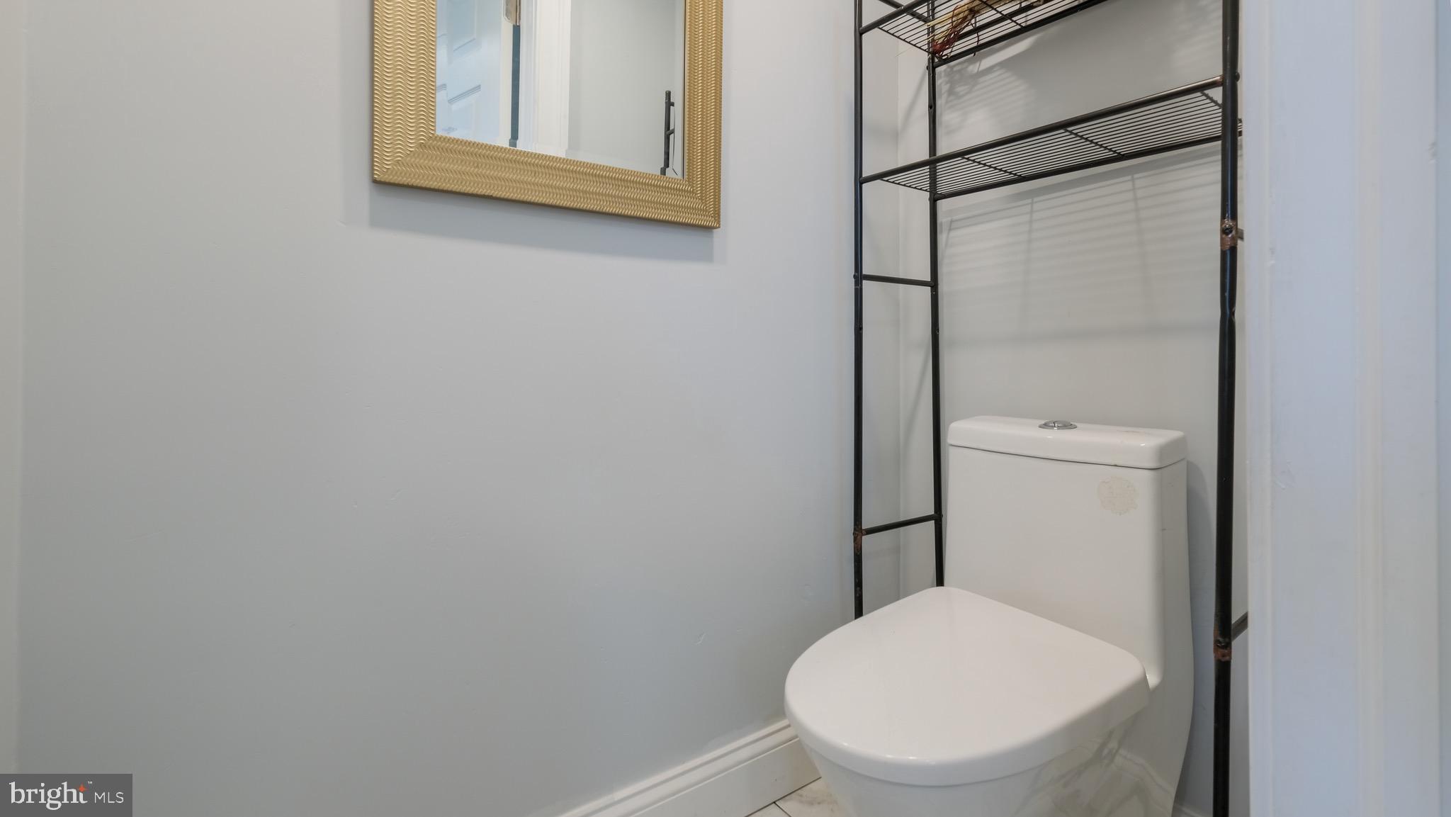 712 North York Road Willow Grove, PA 19090 - Photo 18 of 27 a white toilet sitting next to a bathroom sink