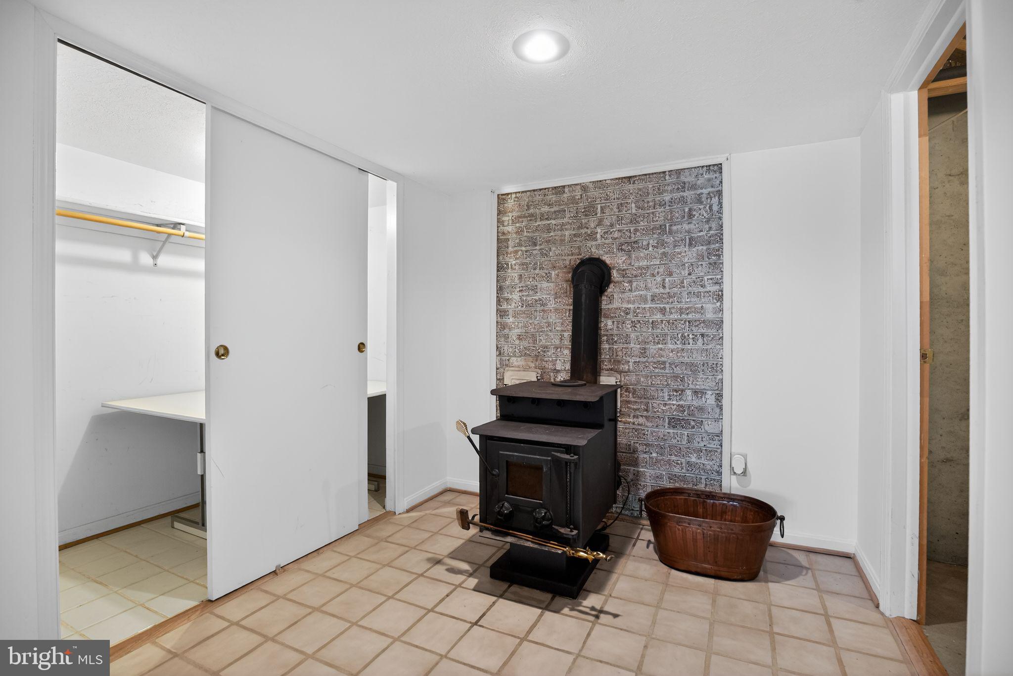 960 Dalrymple Road Sunderland, MD 20689 - Photo 43 of 51 Basement wood burning stove