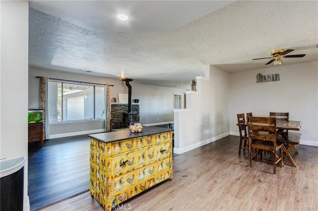 10971 Adobe Road Oak Hills, CA 92344 - Photo 17 of 49 a living room with furniture and a wooden floor