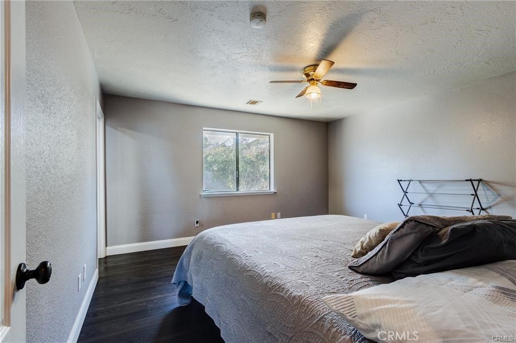 10971 Adobe Road Oak Hills, CA 92344 - Photo 24 of 49 a bedroom with a bed and a window