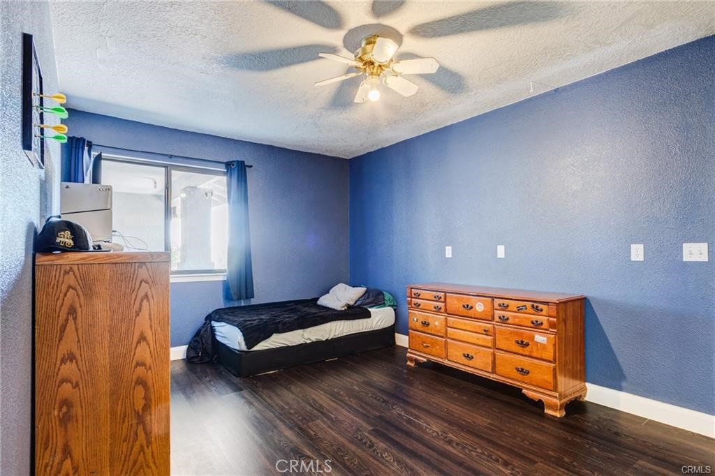 10971 Adobe Road Oak Hills, CA 92344 - Photo 32 of 49 a bedroom with bed and window