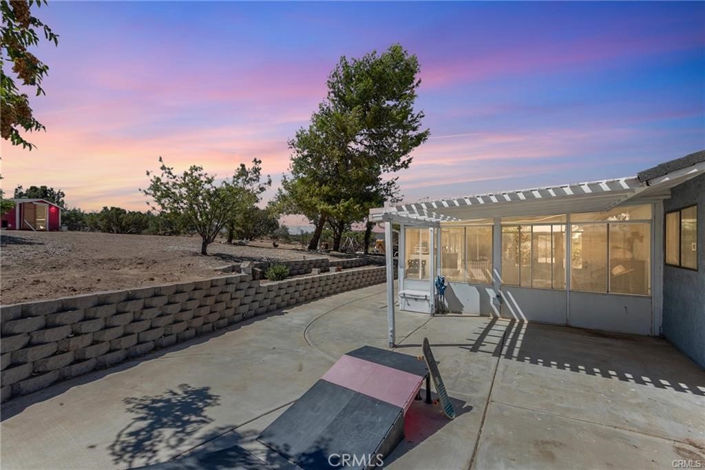 10971 Adobe Road Oak Hills, CA 92344 - Photo 36 of 49 a view of a swimming pool with a lounge chairs