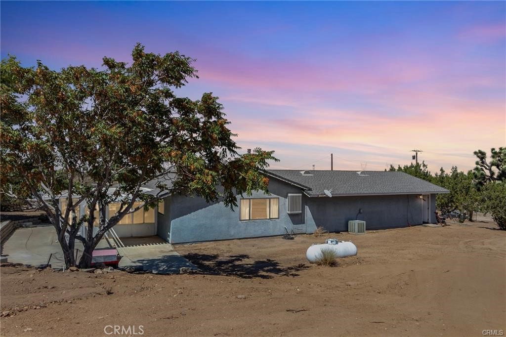 10971 Adobe Road Oak Hills, CA 92344 - Photo 38 of 49 a front view of a house with a yard