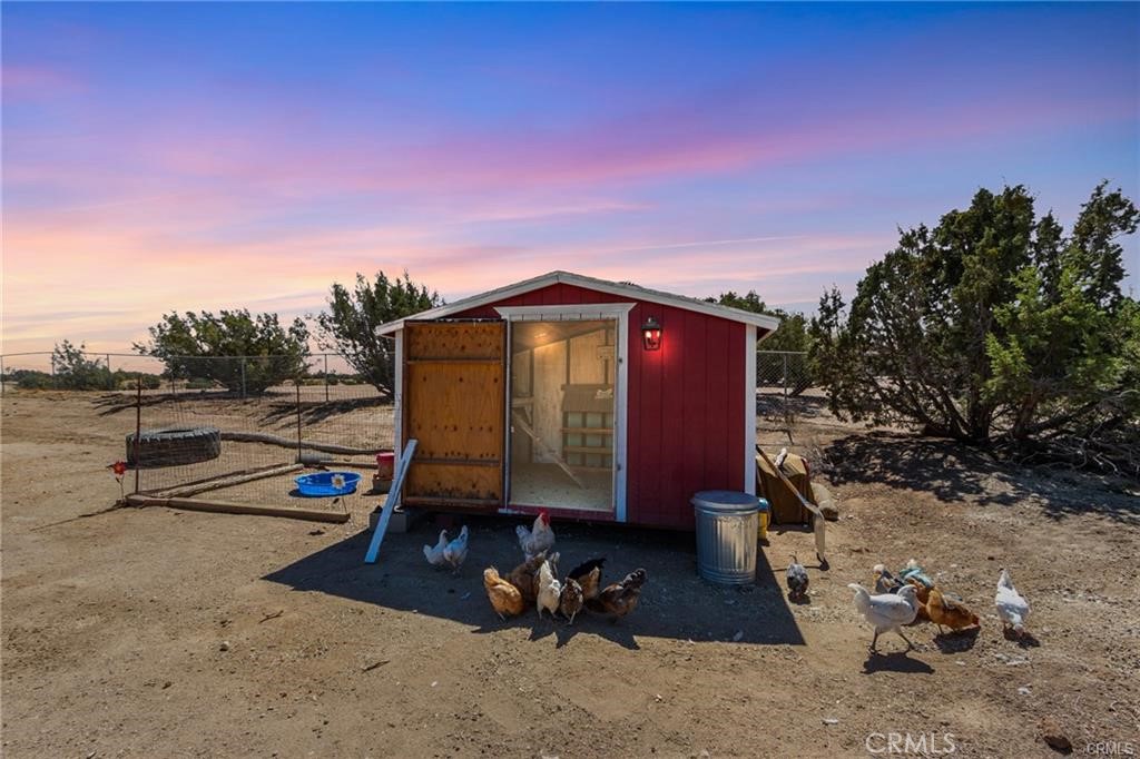10971 Adobe Road Oak Hills, CA 92344 - Photo 40 of 49 a view of backyard with trampoline