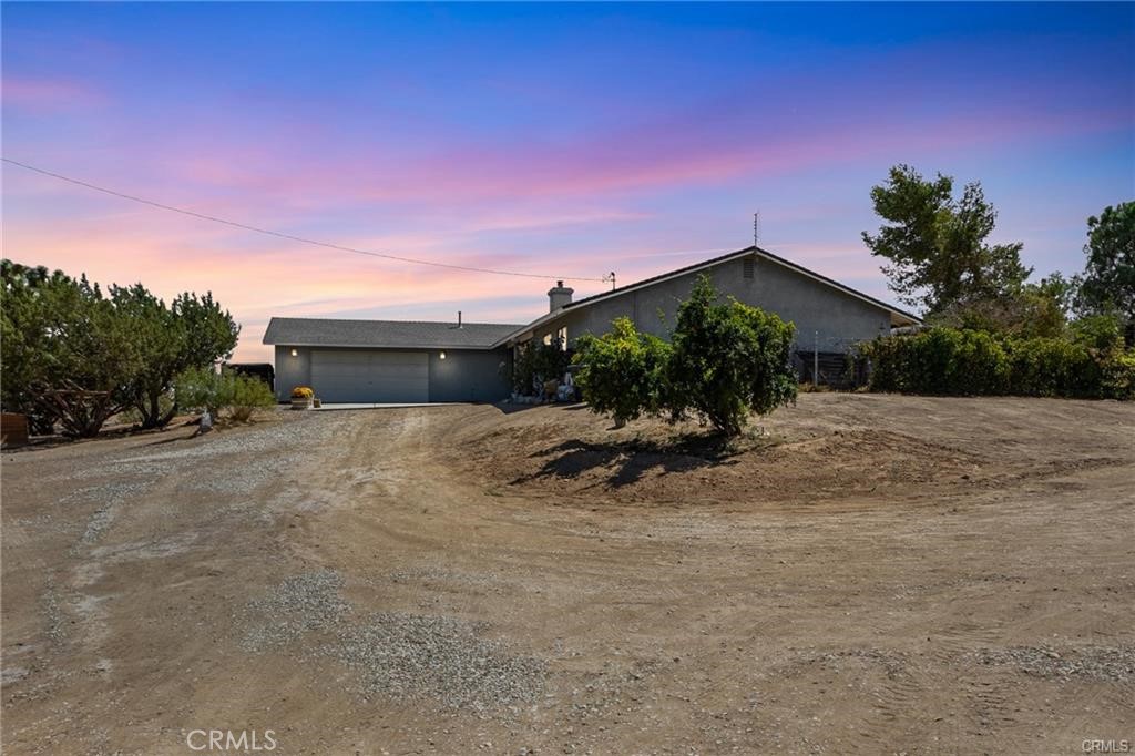 10971 Adobe Road Oak Hills, CA 92344 - Photo 4 of 49 a view of a house with backyard and sitting area