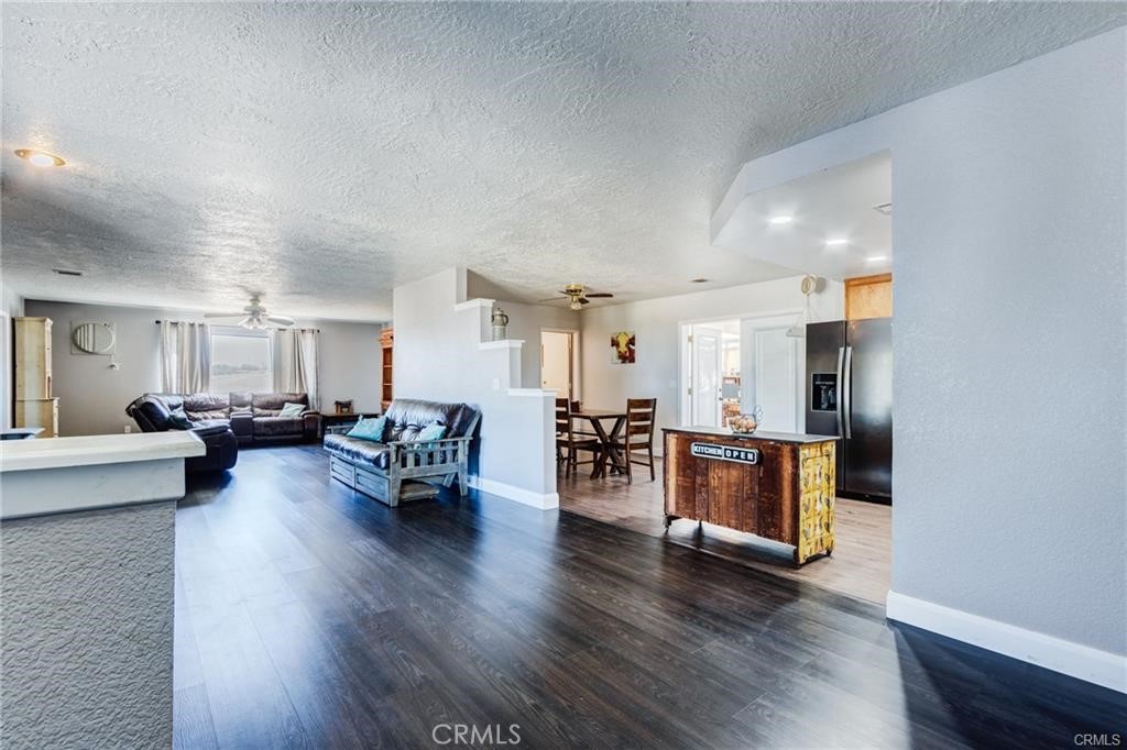 10971 Adobe Road Oak Hills, CA 92344 - Photo 9 of 49 a living room with furniture and wooden floor