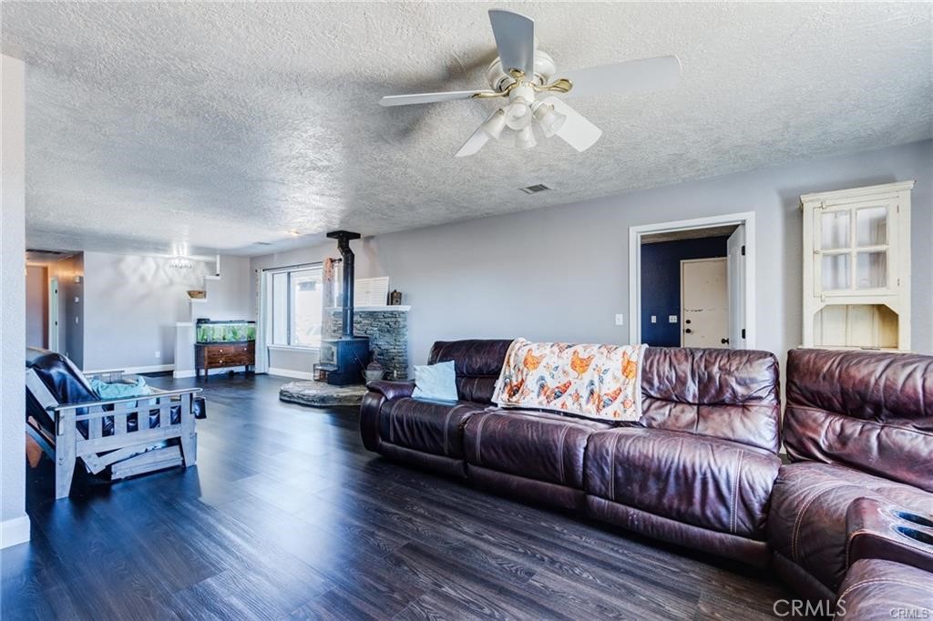 10971 Adobe Road Oak Hills, CA 92344 - Photo 10 of 49 a living room with furniture or couch and a chandelier