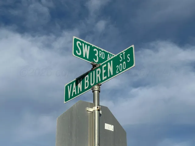a street sign on a pole on a street