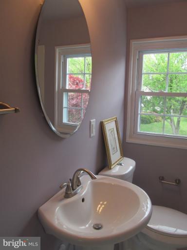 905 Southridge Road Catonsville, MD 21228 - Photo 2 of 14 a bathroom with a sink and a mirror
