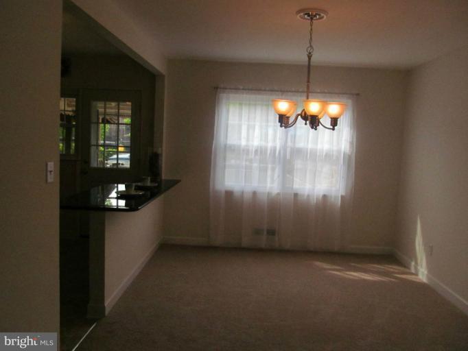 905 Southridge Road Catonsville, MD 21228 - Photo 12 of 14 a room with furniture and lamp