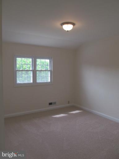 905 Southridge Road Catonsville, MD 21228 - Photo 14 of 14 an empty room with a window