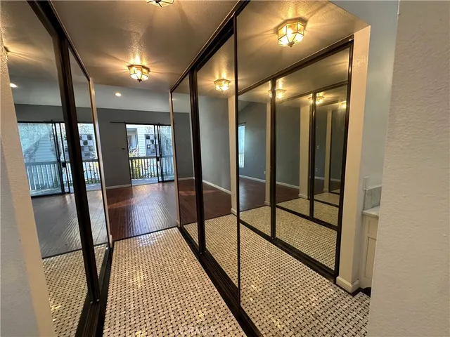 a view of gallery with wooden floor