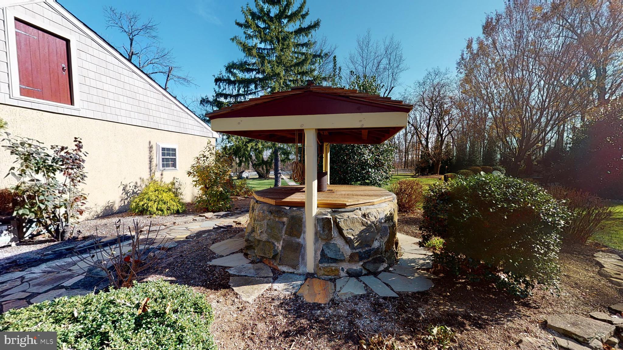 2613 Hill Road Green Lane, PA 18054 - Photo 87 of 146 This restored well is a center piece of Pine Knoll