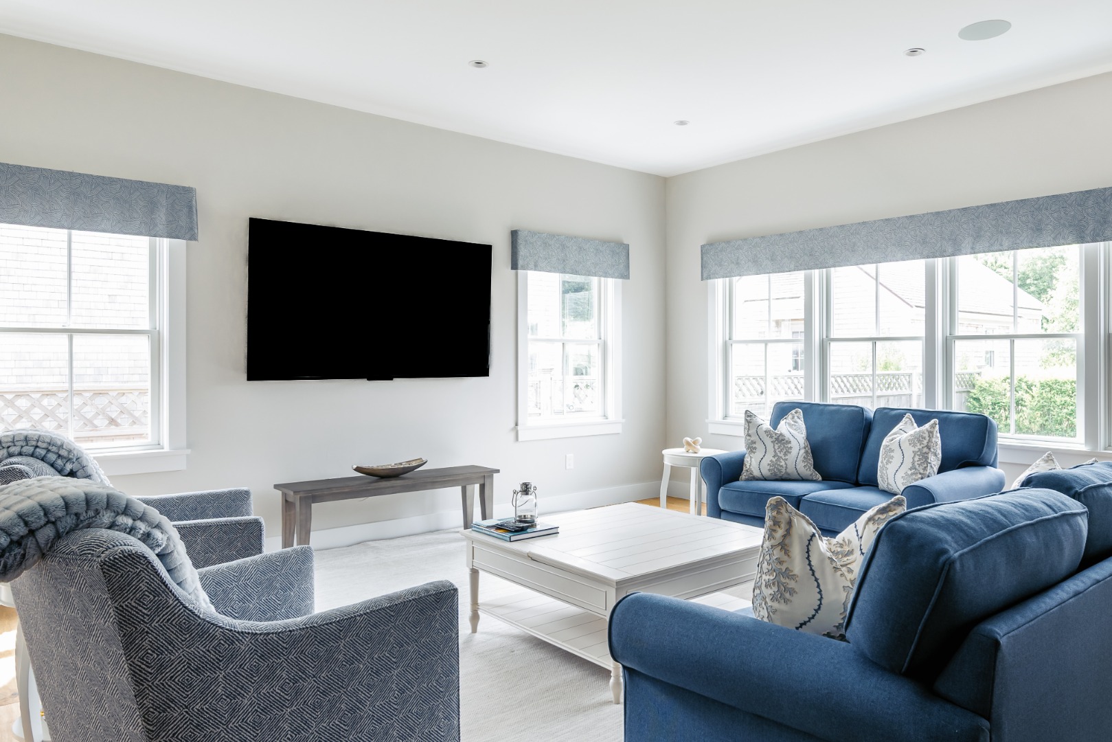 86 Cliff Road Nantucket, MA 02554 - Photo 6 of 29 a living room with furniture a flat screen tv and a large window