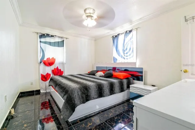 a bedroom with a bed and window