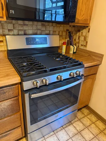 a white refrigerator freezer sitting inside of a kitchen