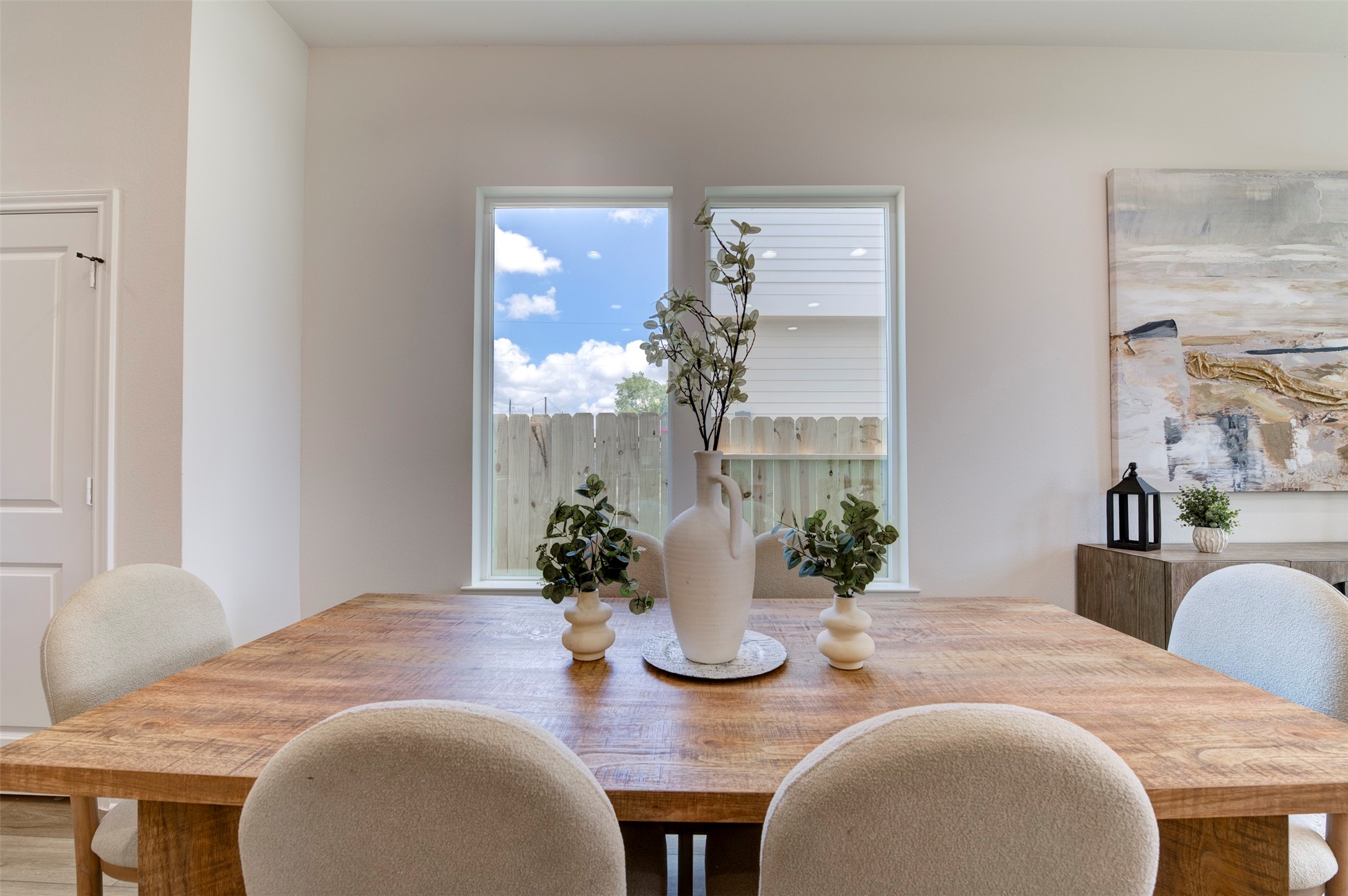 6807 Paris Street Houston, TX 77021 - Photo 6 of 50 Dining area with hardwood floors, dual windows overlooking backyard, and open sightline to living room and kitchen.