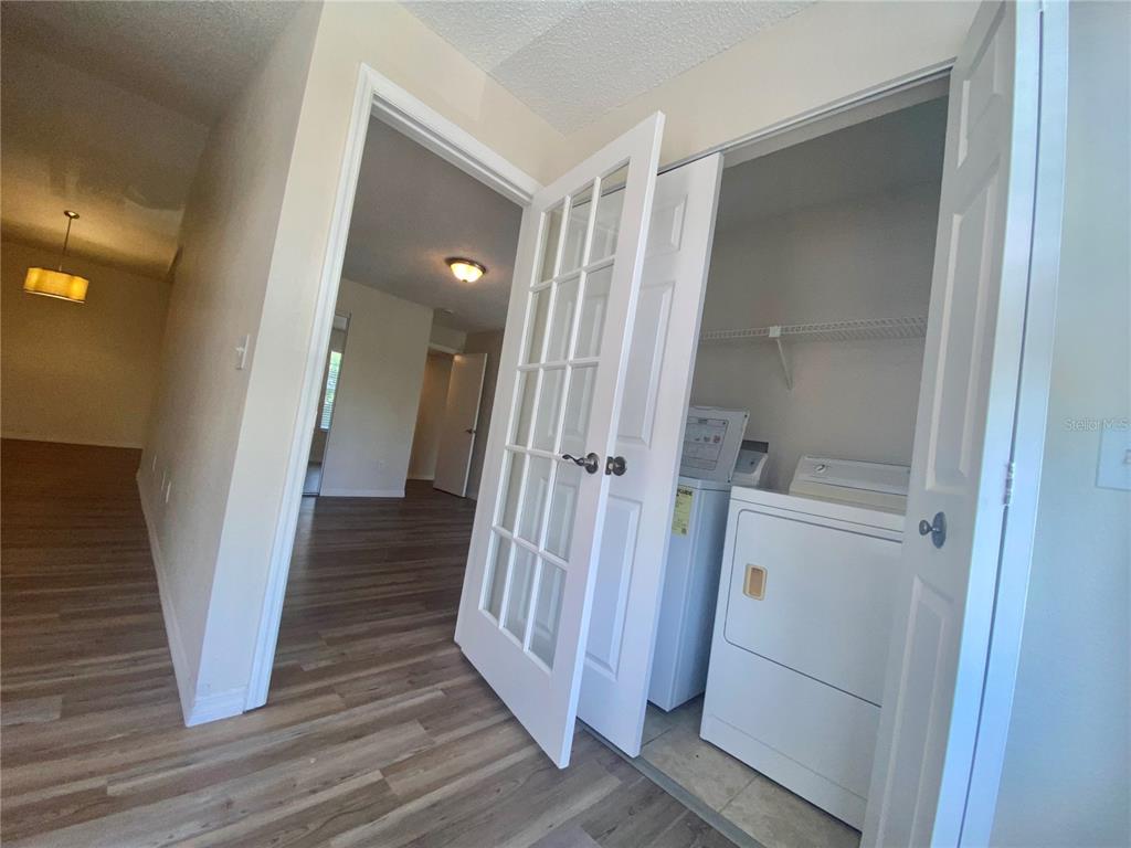 5144 Conroy Road, Unit 38 Orlando, FL 32811 - Photo 15 of 49 a view of a hallway with wooden floor and entryway