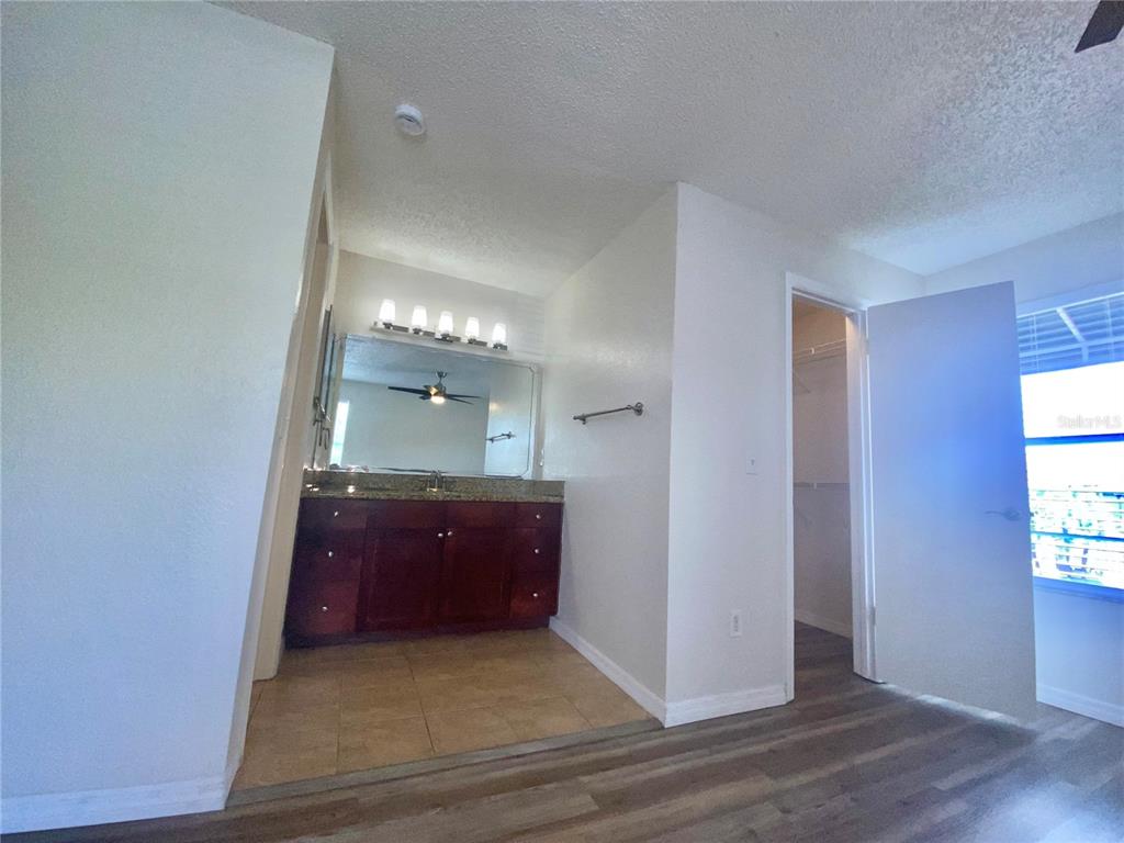 5144 Conroy Road, Unit 38 Orlando, FL 32811 - Photo 24 of 49 an empty room with windows and bathroom