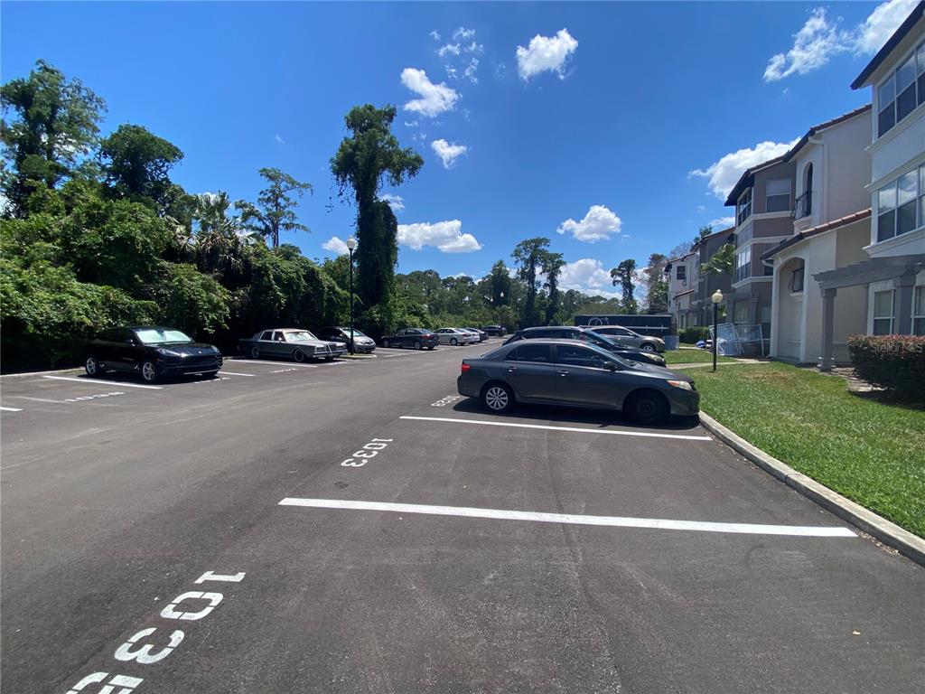5144 Conroy Road, Unit 38 Orlando, FL 32811 - Photo 28 of 49 a view of street with parked cars