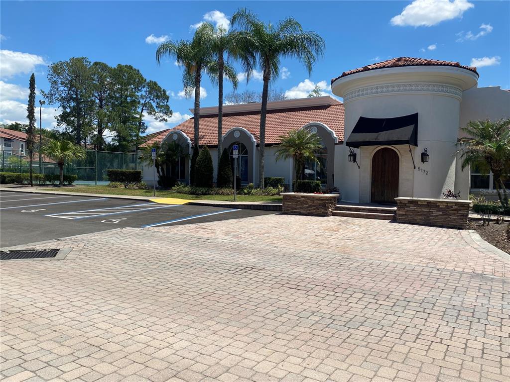 5144 Conroy Road, Unit 38 Orlando, FL 32811 - Photo 29 of 49 a view of a building with palm trees