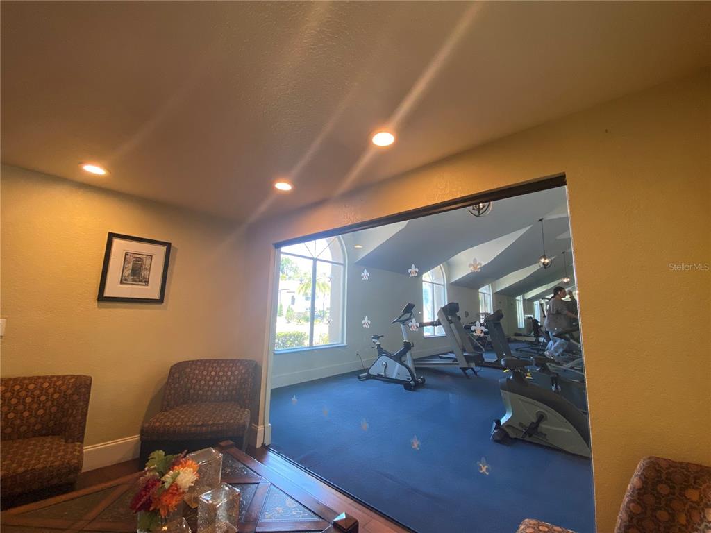 5144 Conroy Road, Unit 38 Orlando, FL 32811 - Photo 32 of 49 a living room with furniture and wooden floor