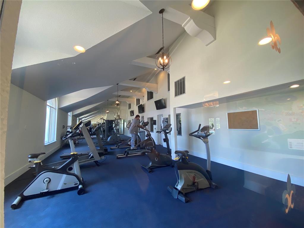 5144 Conroy Road, Unit 38 Orlando, FL 32811 - Photo 34 of 49 a view of a room with gym equipment