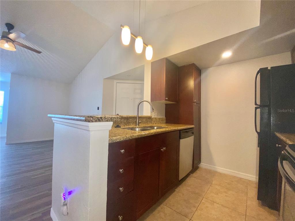 5144 Conroy Road, Unit 38 Orlando, FL 32811 - Photo 5 of 49 a bathroom with a sink vanity and a mirror