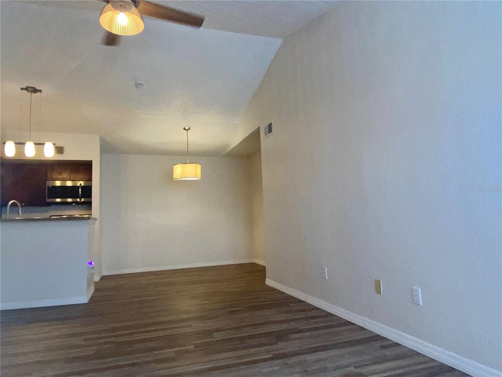 5144 Conroy Road, Unit 38 Orlando, FL 32811 - Photo 9 of 49 a view of empty room with wooden floor