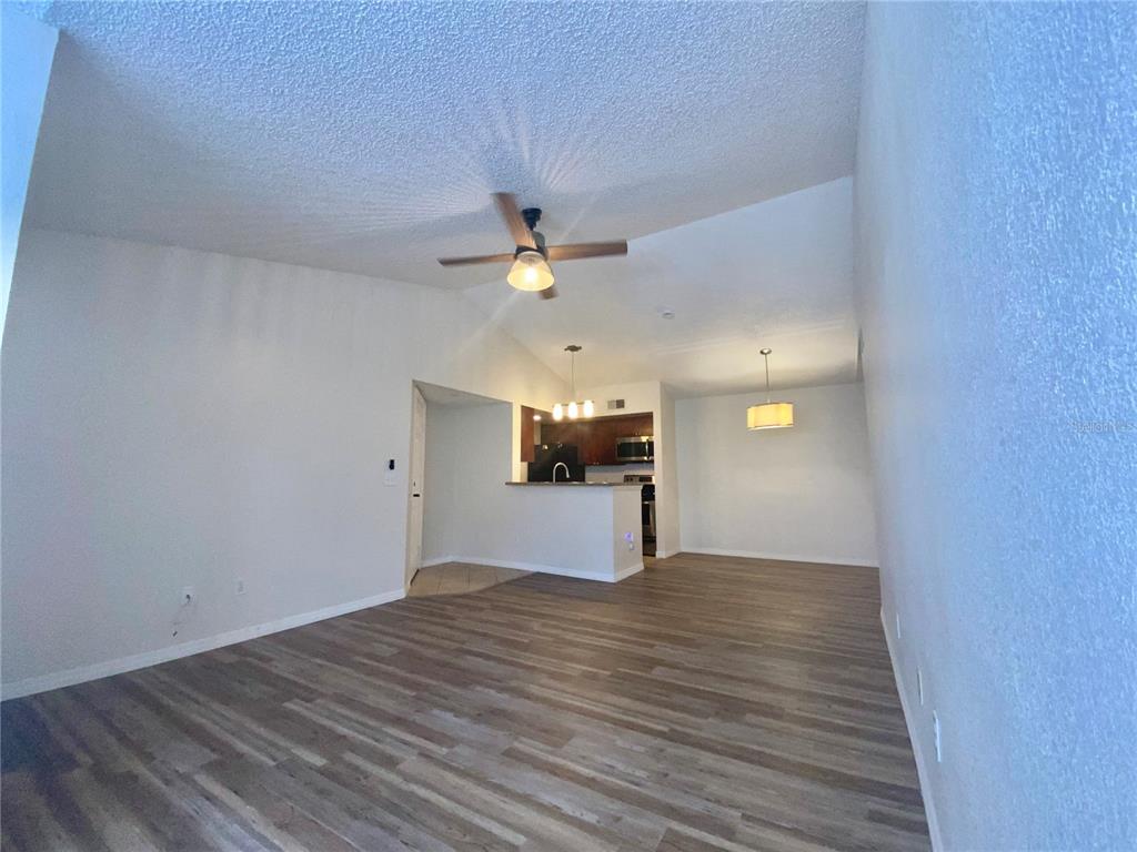 5144 Conroy Road, Unit 38 Orlando, FL 32811 - Photo 10 of 49 a view of empty room with wooden floor