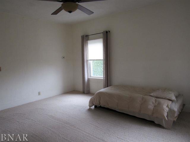 6972 Red Road Clinton, IL 61727 - Photo 12 of 17 a room with a bed and a window
