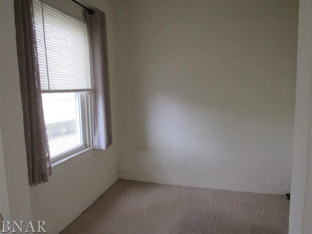 6972 Red Road Clinton, IL 61727 - Photo 15 of 17 an empty room with a window