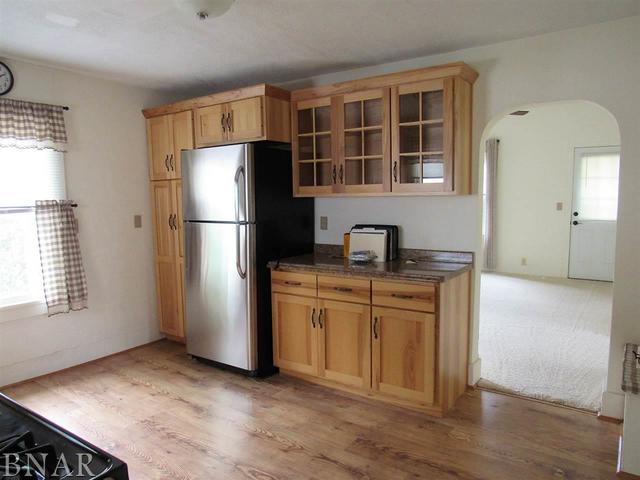 6972 Red Road Clinton, IL 61727 - Photo 10 of 17 a kitchen with stainless steel appliances granite countertop a refrigerator sink and stove