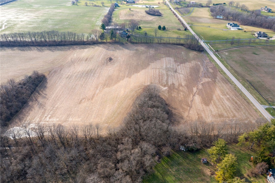 Lot 1 Lot Road Springboro, OH 45066 - Photo 8 of 13 An expansive rural landscape awaits, featuring vast open fields and distant residences.