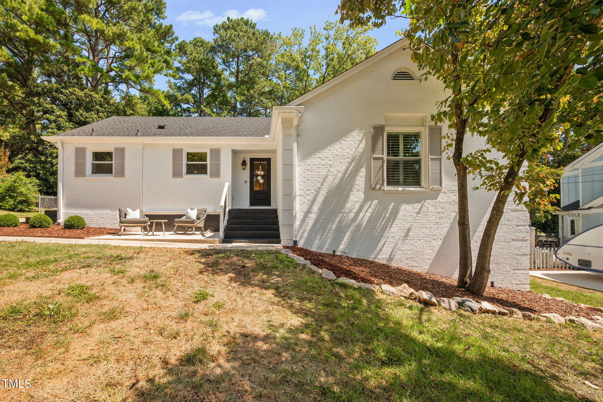 4808 Latimer Road Raleigh, NC 27609 - Photo 1 of 39 a view of a backyard with a large tree