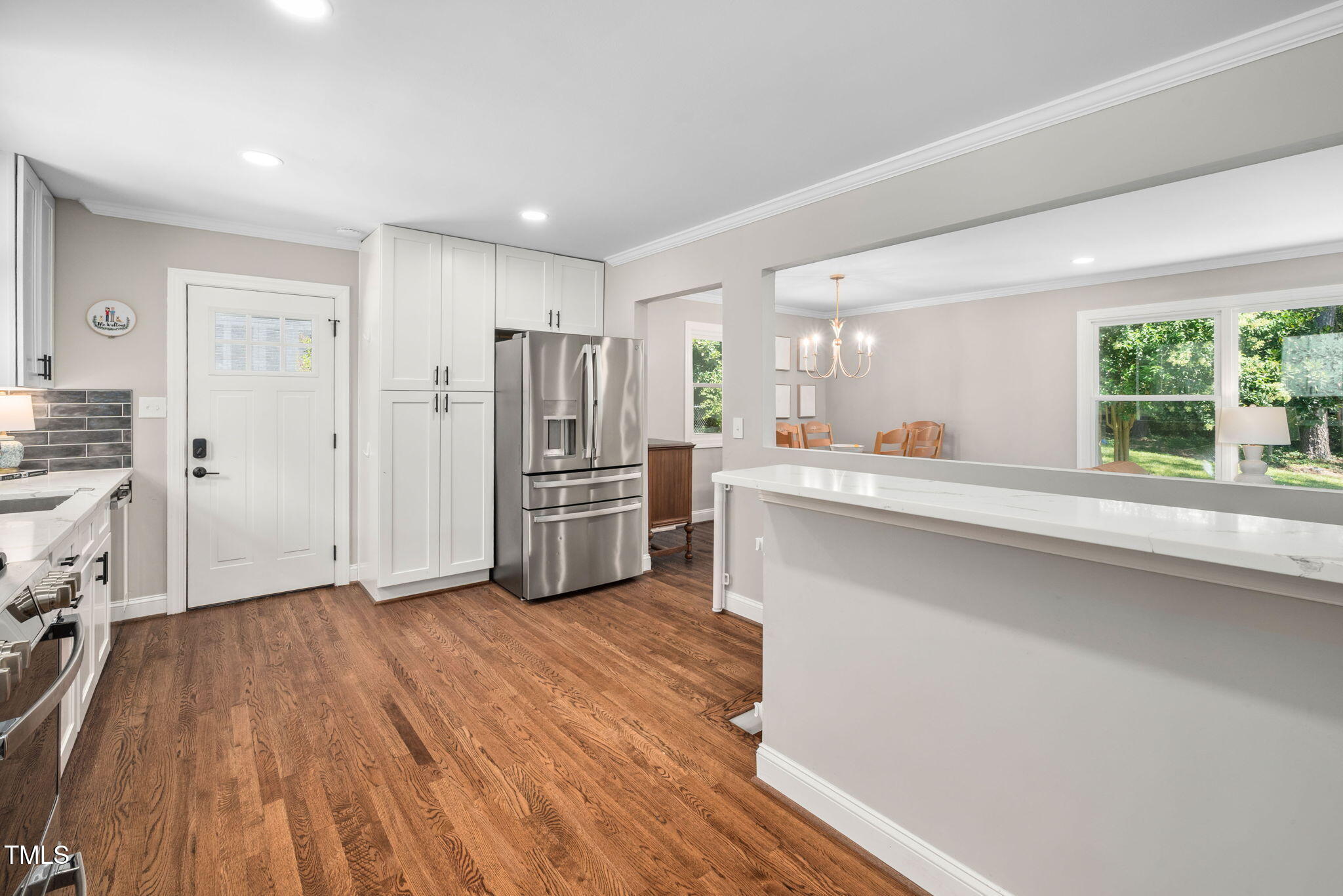 4808 Latimer Road Raleigh, NC 27609 - Photo 13 of 39 a kitchen with stainless steel appliances a refrigerator and a stove top oven