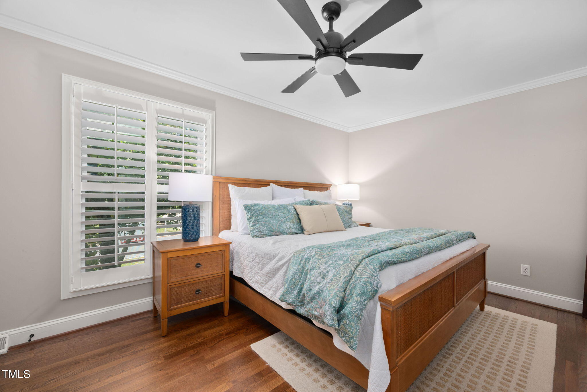 4808 Latimer Road Raleigh, NC 27609 - Photo 21 of 39 a bedroom with a bed and a large window